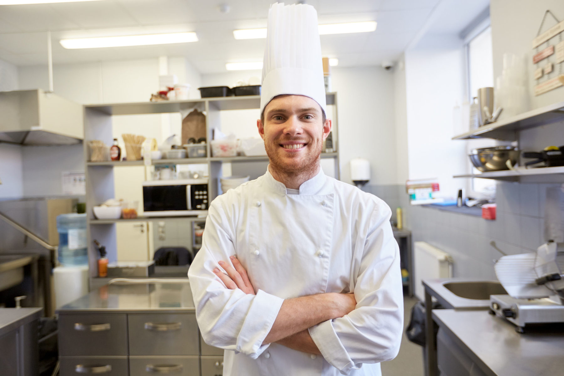 happy male chef cook at restaurant kitchen